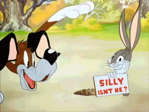 Animation showing Bugsbunny showing sign that says "silly isn't he" and a dog clowning around.