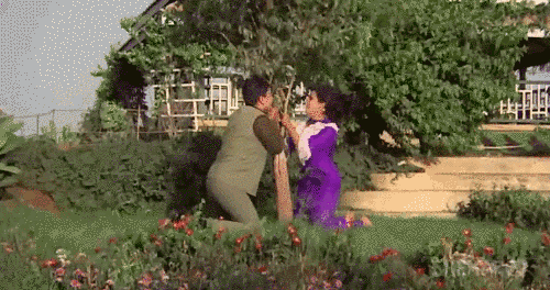 Animation showing a man and woman dancing around a tree